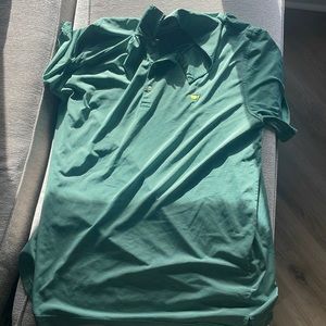 A Green Masters polo.